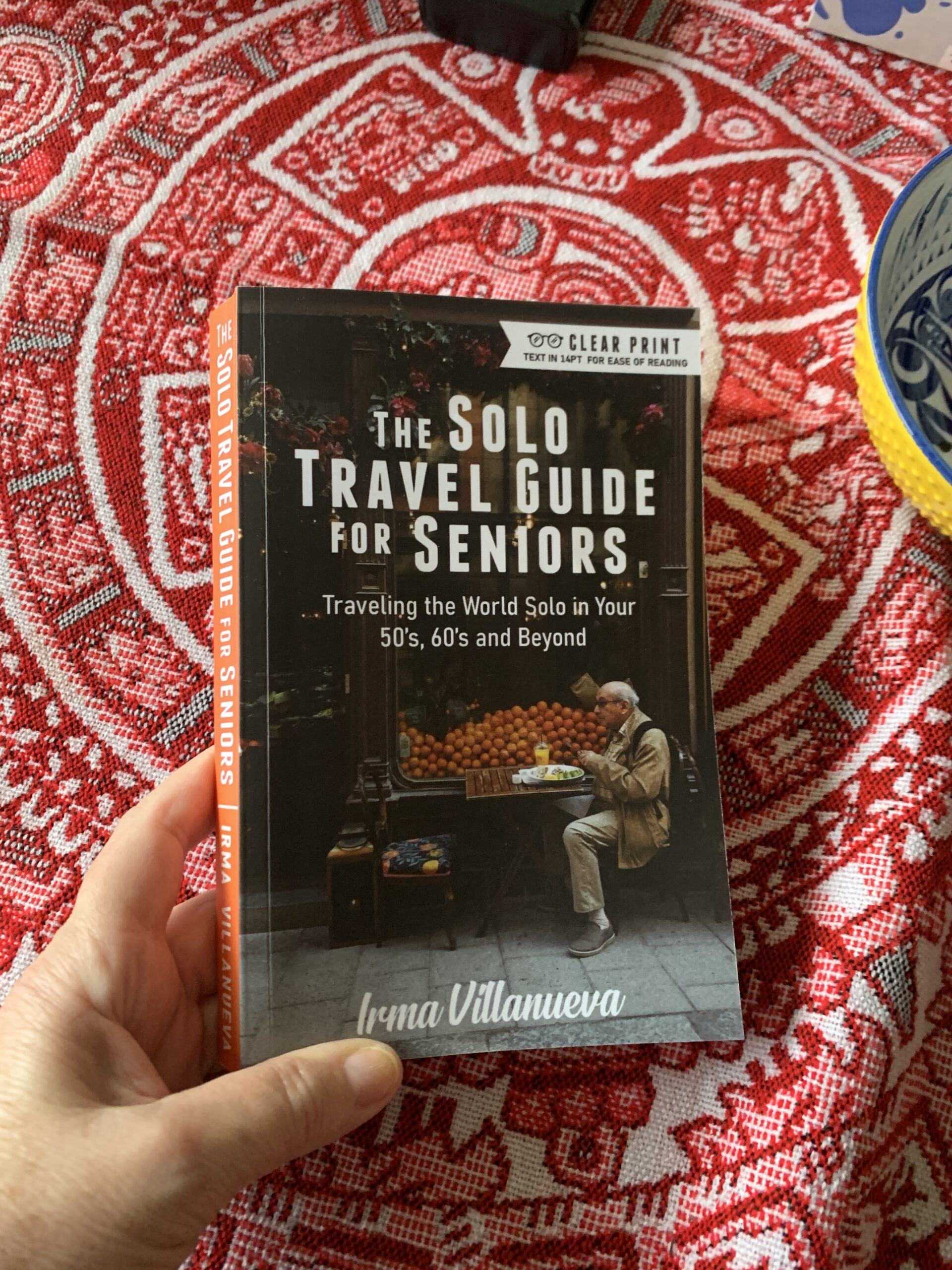 Solo travel Guide for Seniors solo-travel-guide-for-seniors-book-in-hand